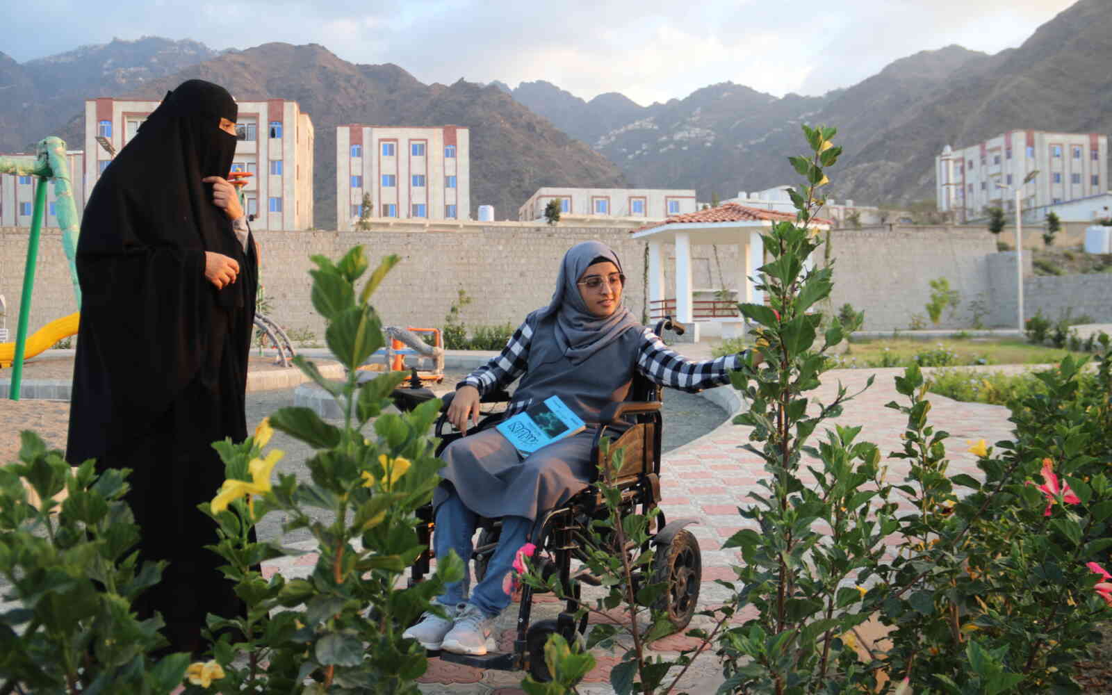 Mehad, a resident of Taiz City, Yemen, enjoys a restored park in her community.