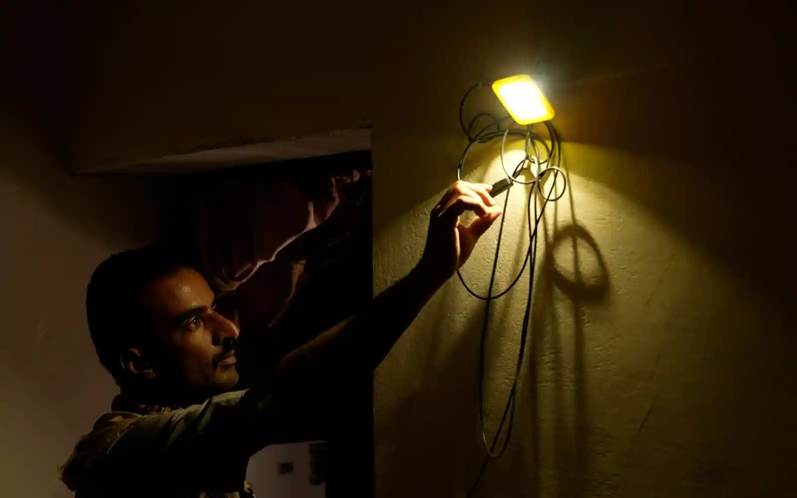 A small portable solar energy system helps Majed meet his basic energy needs in Marib, Yemen.
