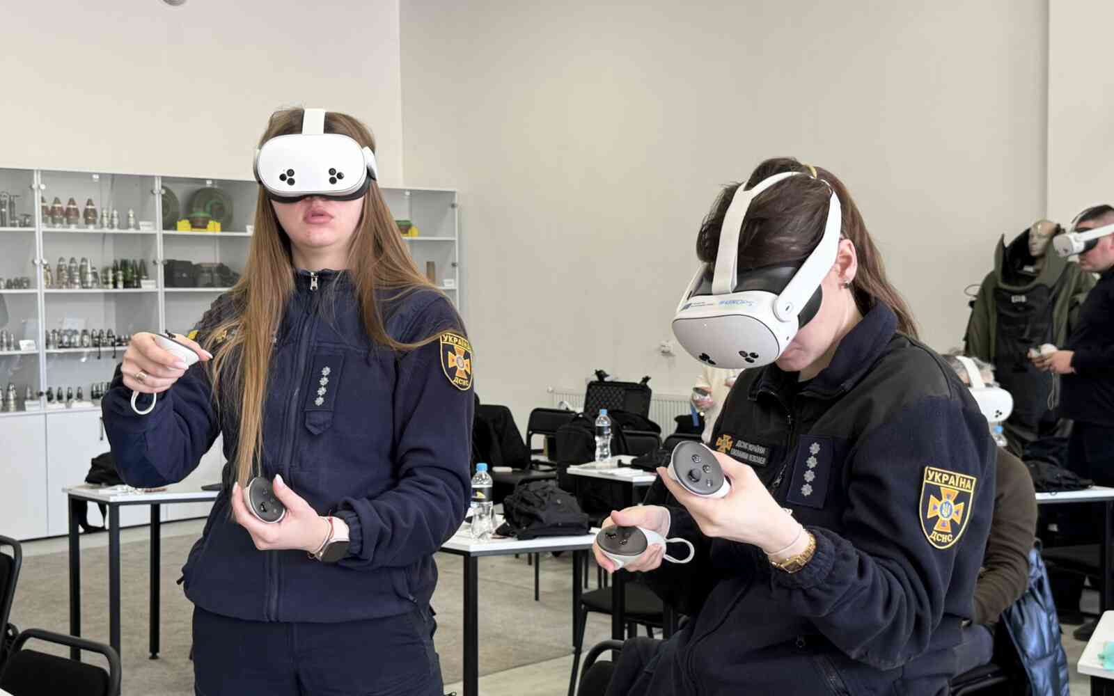 Ukraine’s State Emergency Service experts interact with the virtual reality application during a training session.