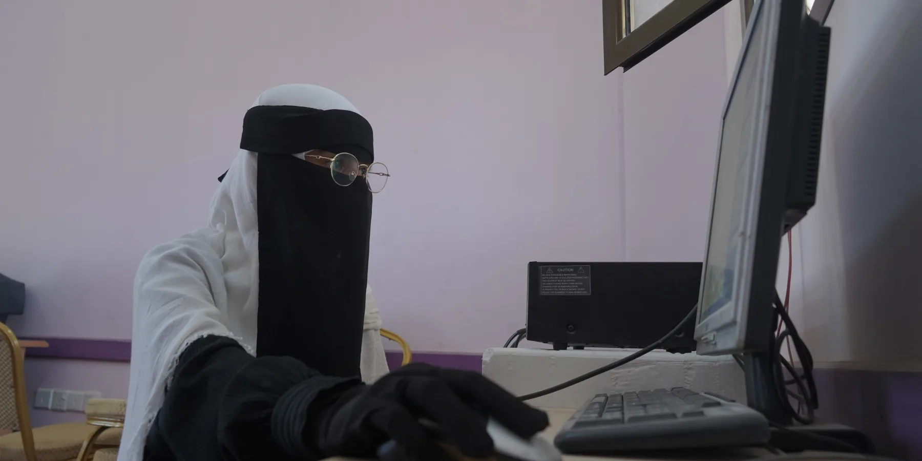 Ehsan, a student at a school in Madoda in Hadhramaut governorate, practices computer science.