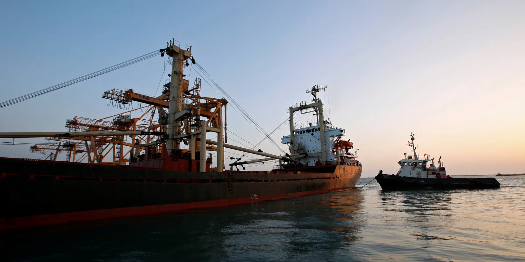 A ship carrying 5,500 tonnes of flour is towed by a tugboat at the Red Sea port of Hodeidah, Yemen, 26 November 2017.