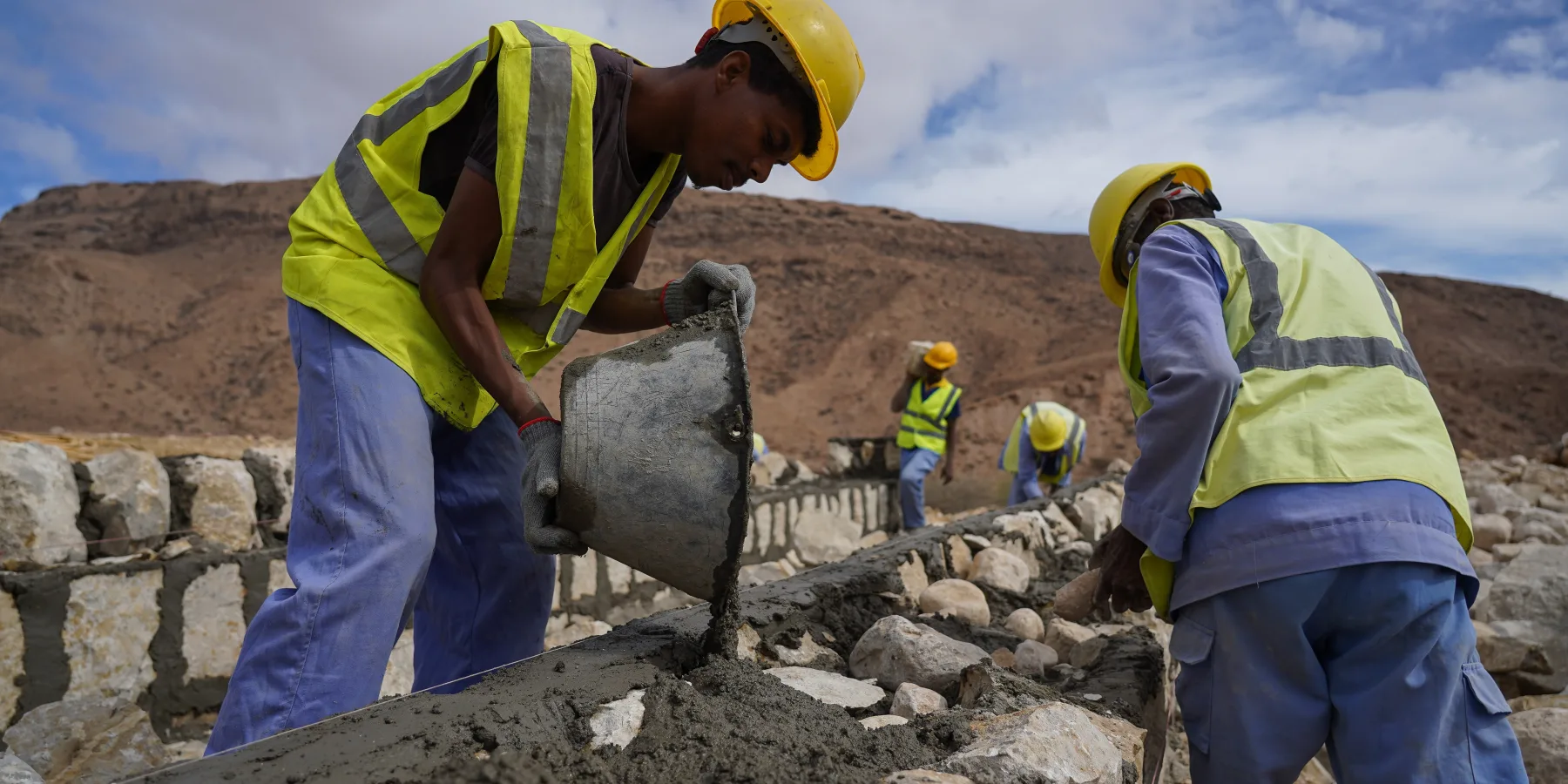 In Mukalla, Hadhramaut governorate, masons construct masonry culverts for flood routing. These structures help to divert excess water flow during heavy rainfall, preventing flooding and protecting infrastructure and communities.