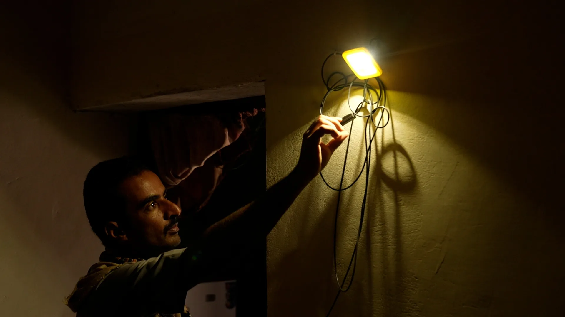 A small portable solar energy system helps Majed meet his basic energy needs in Marib, Yemen.