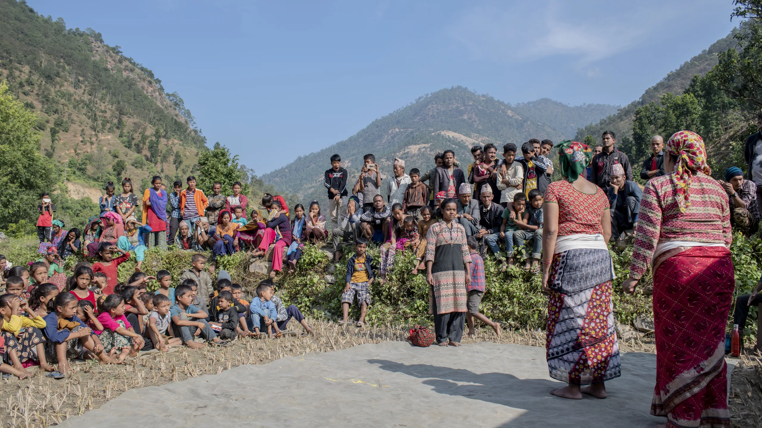 Community watching the drama at Morkha, Jajarkot- the young girl returning to her parents home after losing her baby.
