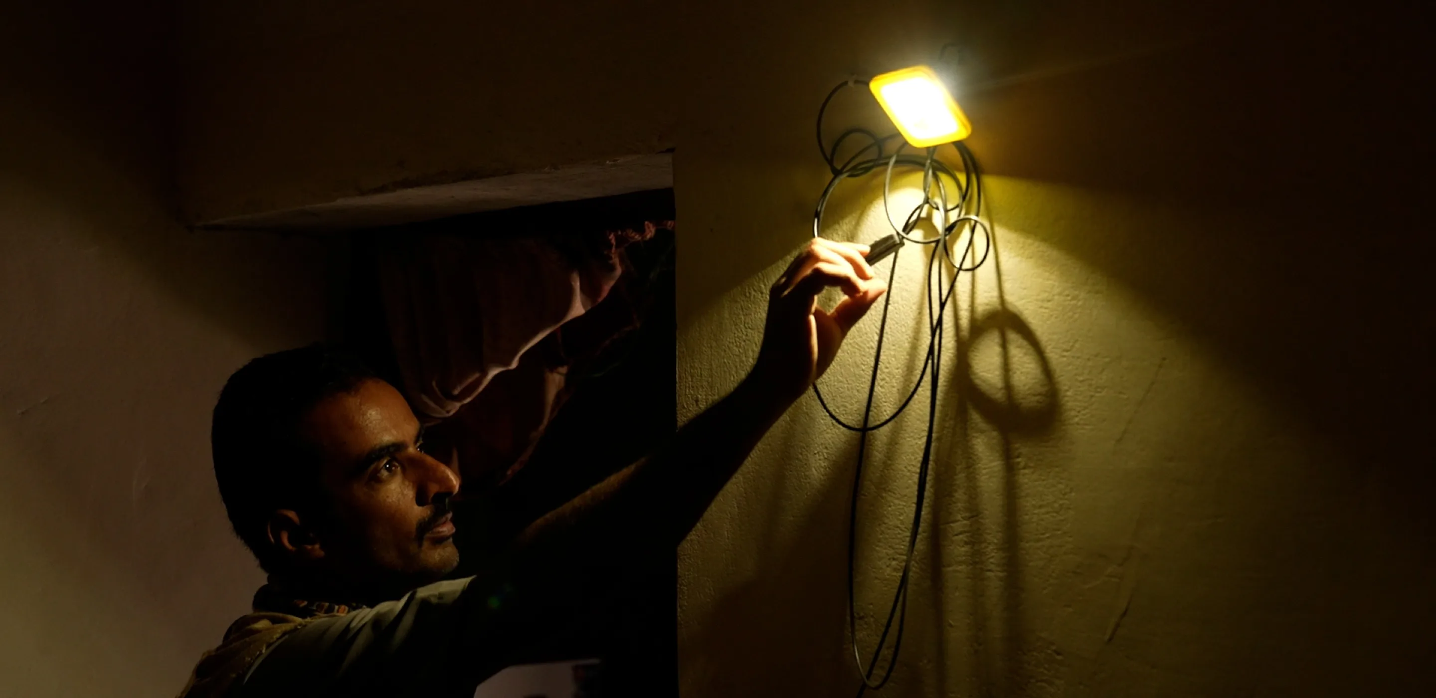 A small portable solar energy system helps Majed meet his basic energy needs in Marib, Yemen.