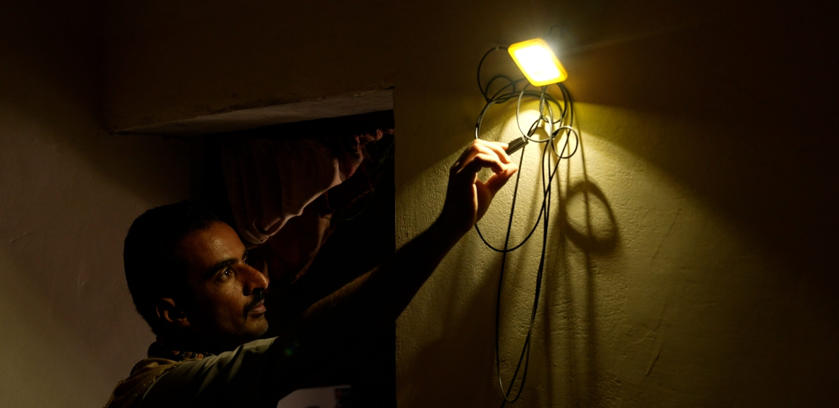 A small portable solar energy system helps Majed meet his basic energy needs in Marib, Yemen.