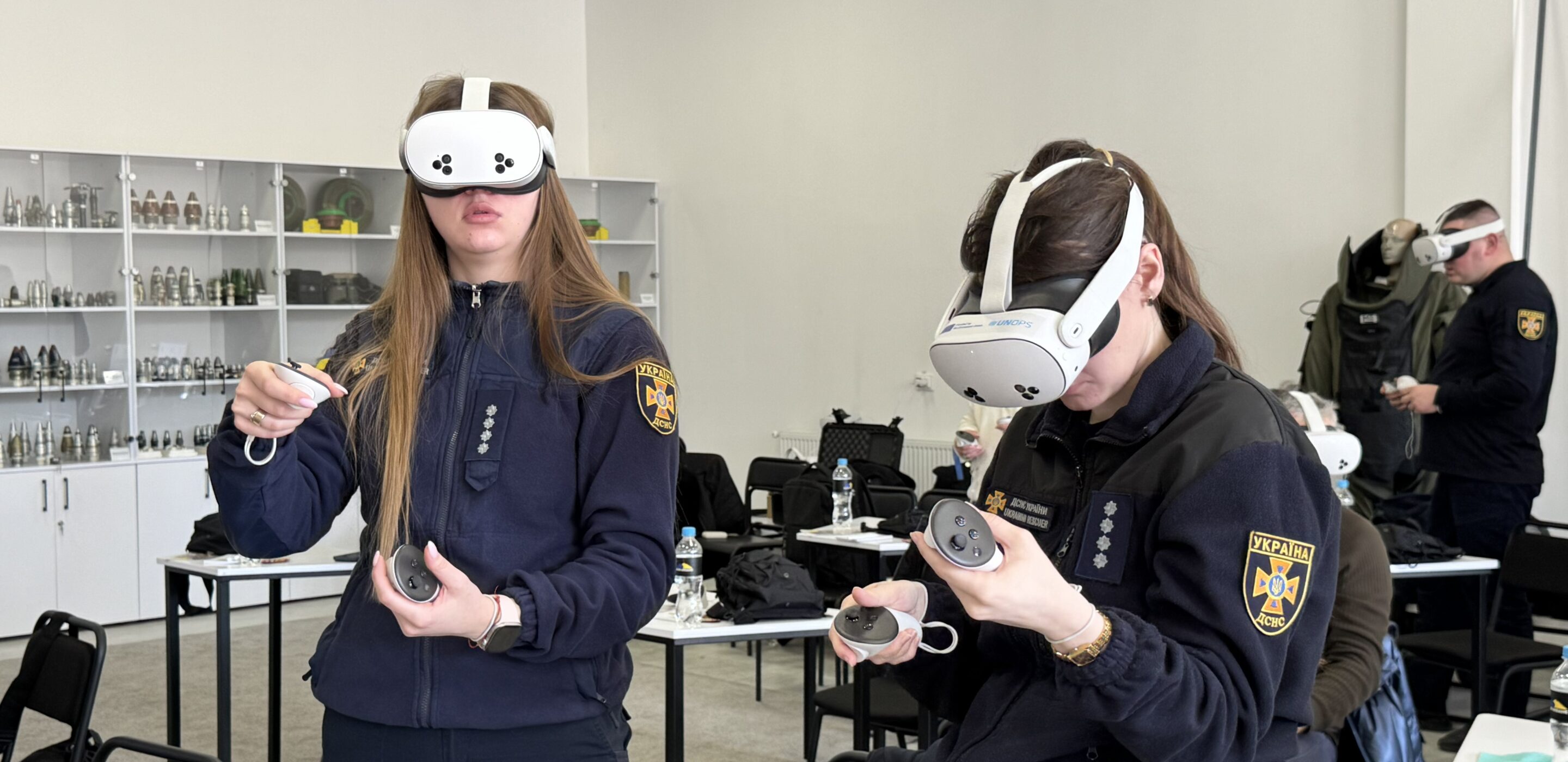 Ukraine’s State Emergency Service experts interact with the virtual reality application during a training session.