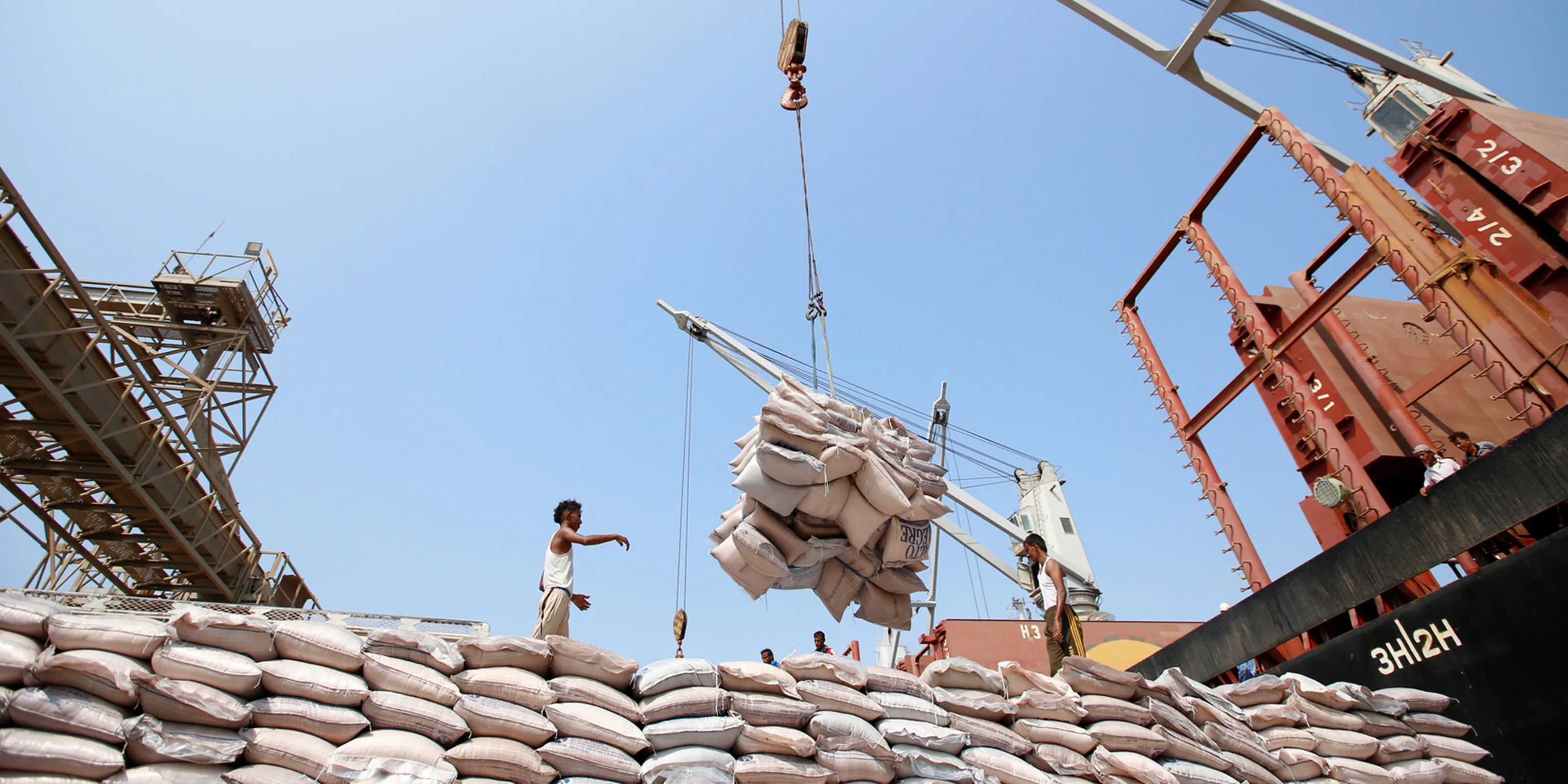 A cargo ship unloads sugar at the Red Sea port of Saleef, Yemen, 30 September 2017.