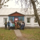 Students with their teacher standing in front of the renovated Pisky Secondary School. ©UNOPS/Veronika Yaresko