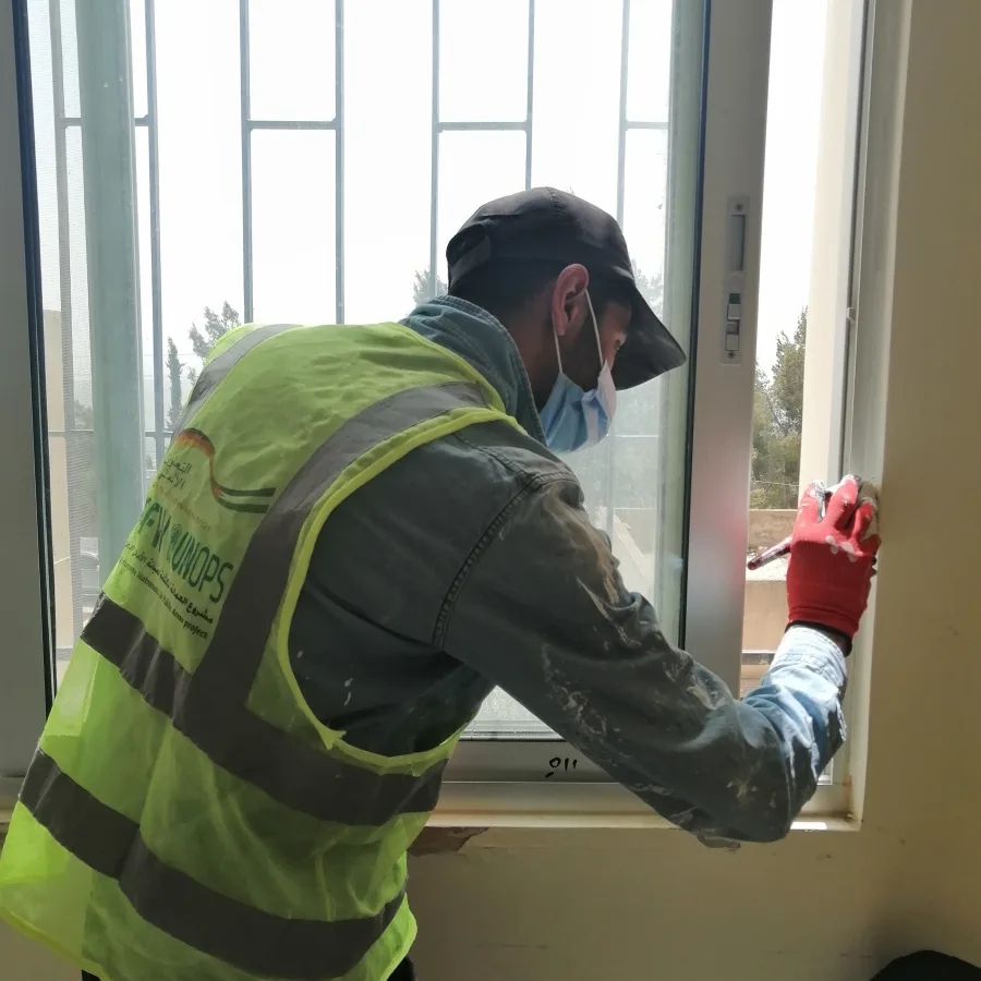 Peinture de murs dans l’école pour garçons Al Nuzhu.