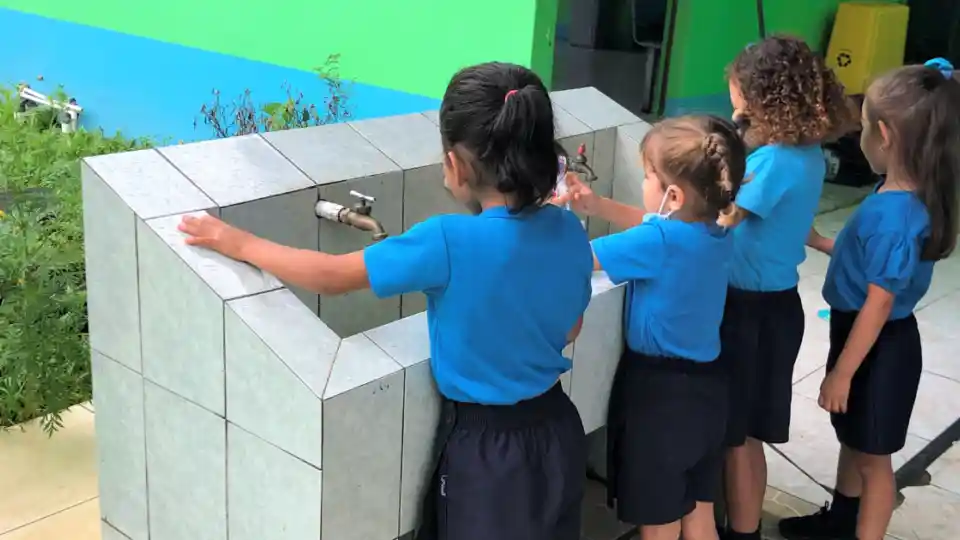 Young children make use of proper water and sanitation services at a school in Costa Rica.