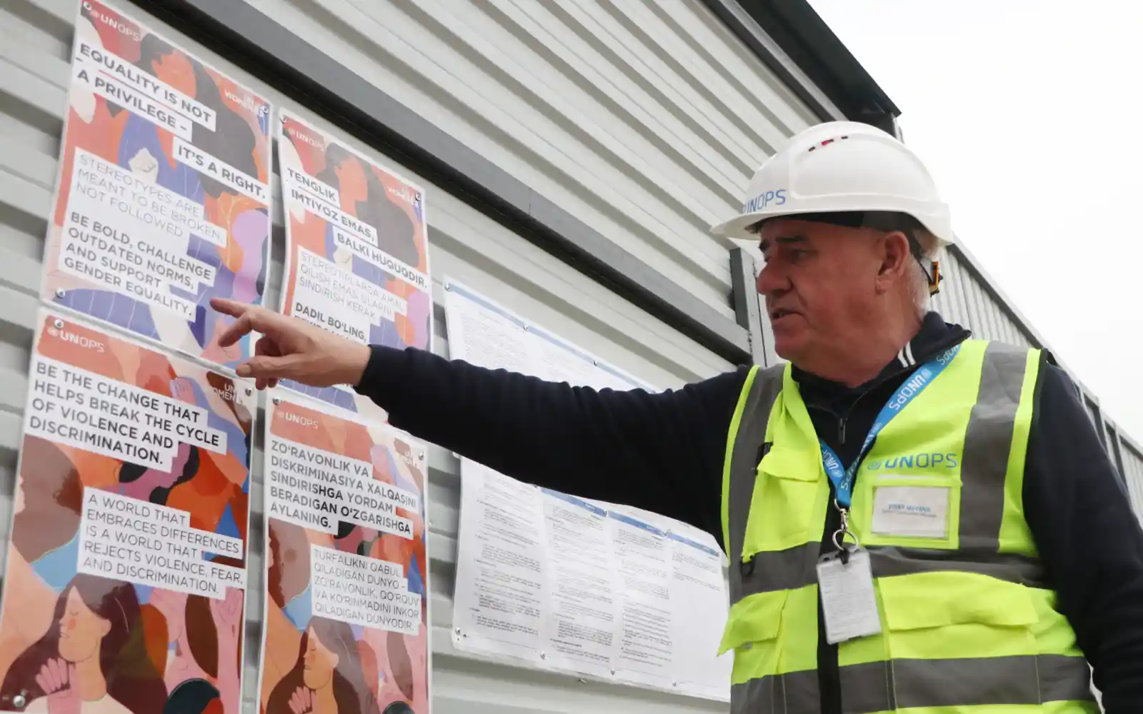 A UNOPS representative underscores the importance of equality and gender inclusivity during an on-site workplace awareness campaign.