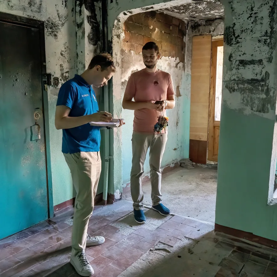 This stairwell caught fire, but it miraculously did not spread to the apartments, leaving a good chance for restoration.