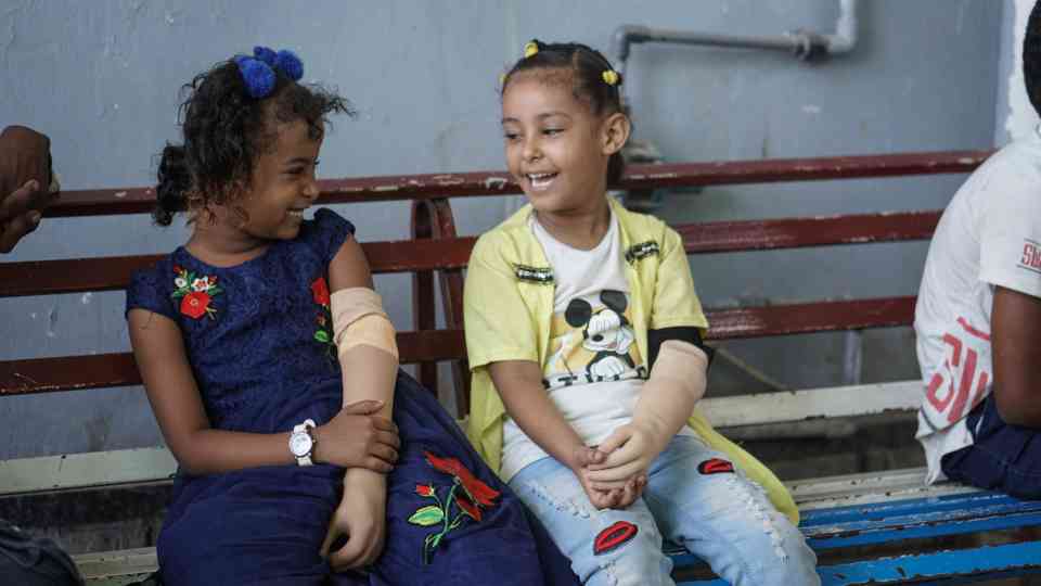 Malk, 7, and Abrar, 7, in the prosthetics centre in Aden, Yemen on 14 October 2021. Both children have a congenital disability and are receiving treatment in the centre.